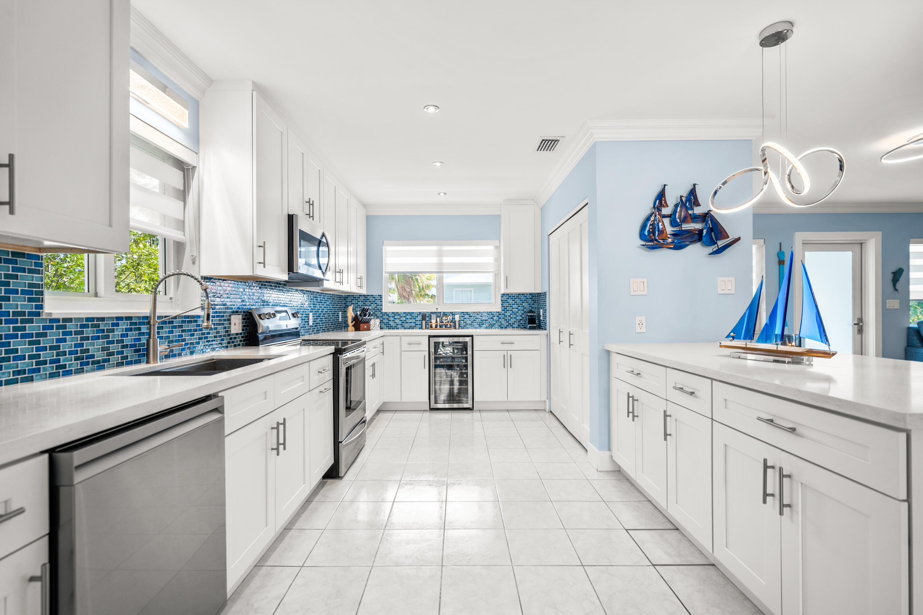 130 Lorelane Place Key Largo, FL 33037 - Photo 12 of 67 a large kitchen with cabinets