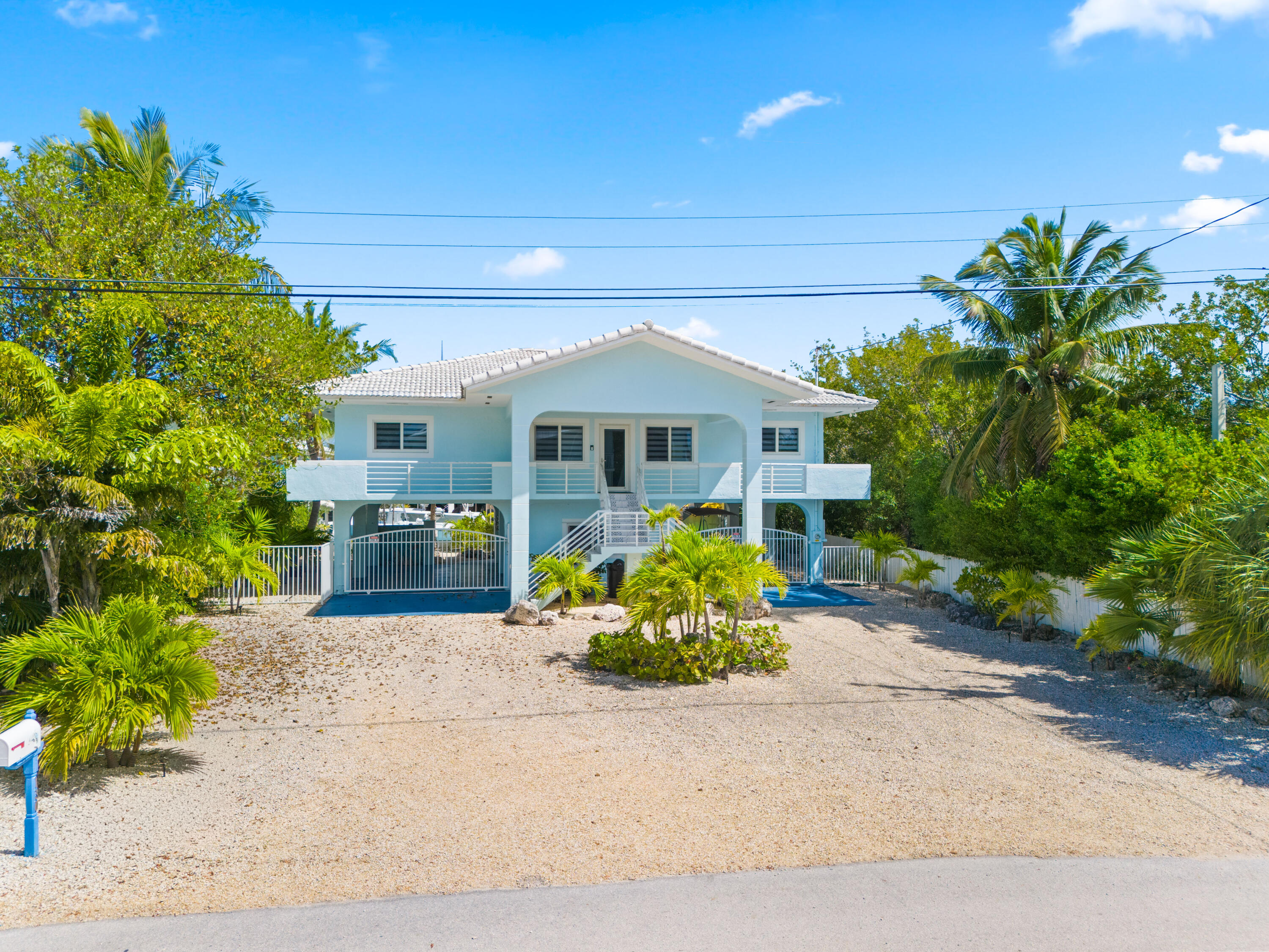 130 Lorelane Place Key Largo, FL 33037 - Photo 2 of 67 front view of a house with a yard