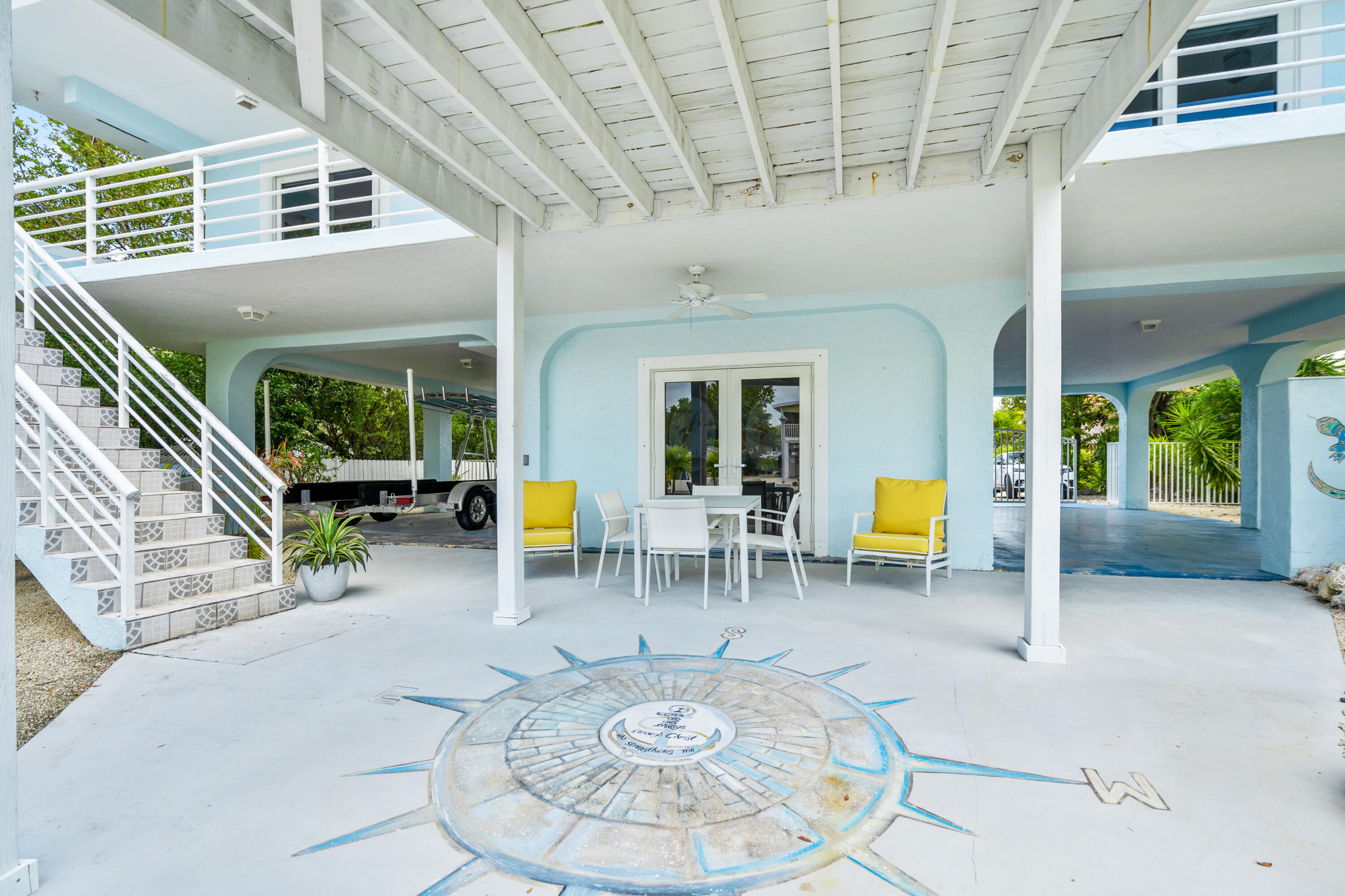 130 Lorelane Place Key Largo, FL 33037 - Photo 32 of 67 a view of a swimming pool with chairs in patio