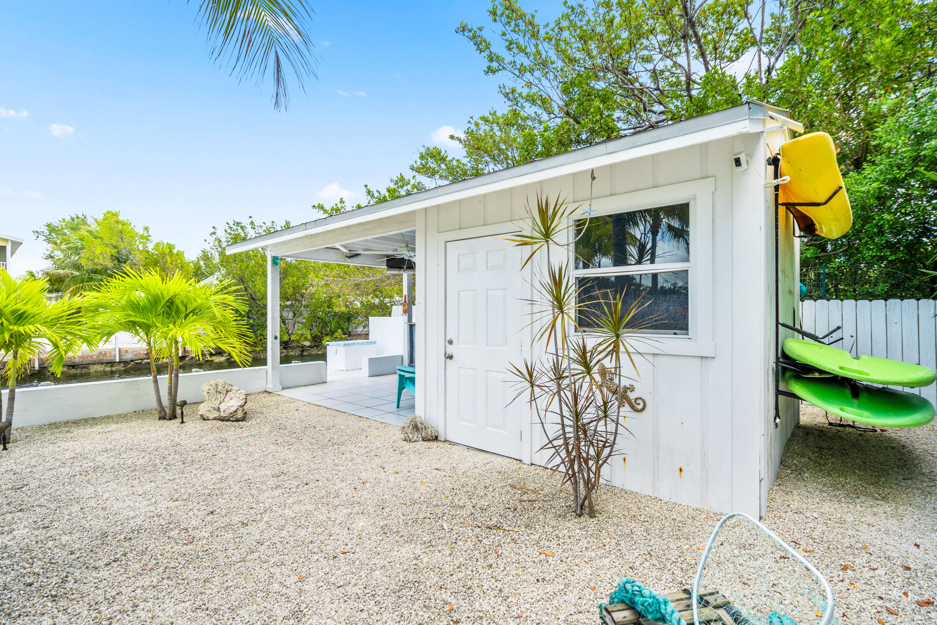 130 Lorelane Place Key Largo, FL 33037 - Photo 44 of 67 a view of a house with backyard and a tree