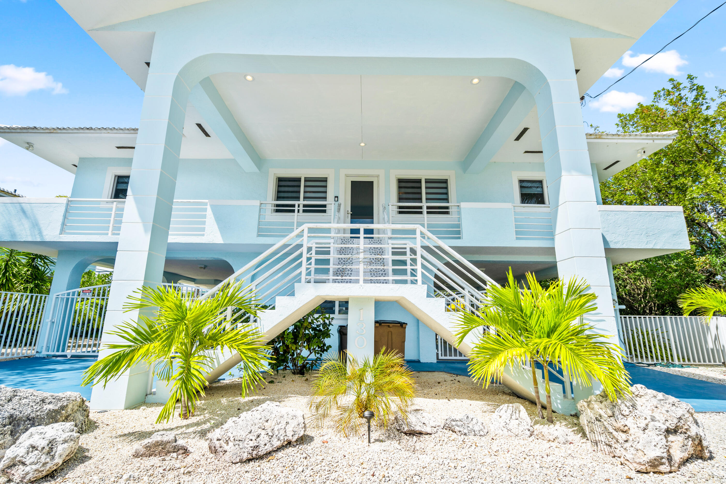 130 Lorelane Place Key Largo, FL 33037 - Photo 56 of 67 a front view of a house with garden