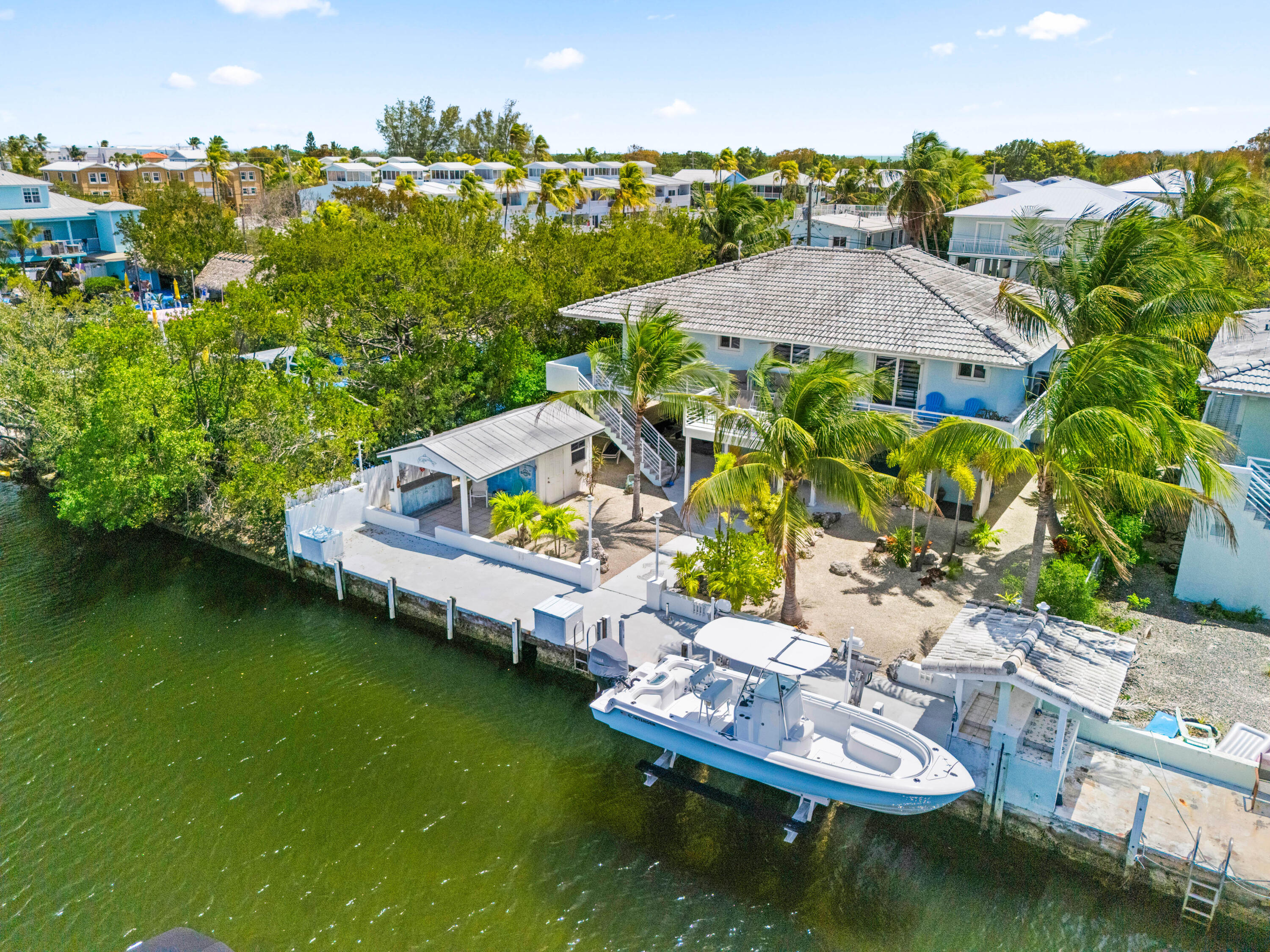 130 Lorelane Place Key Largo, FL 33037 - Photo 59 of 67 an aerial view of house with yard swimming pool and lake view