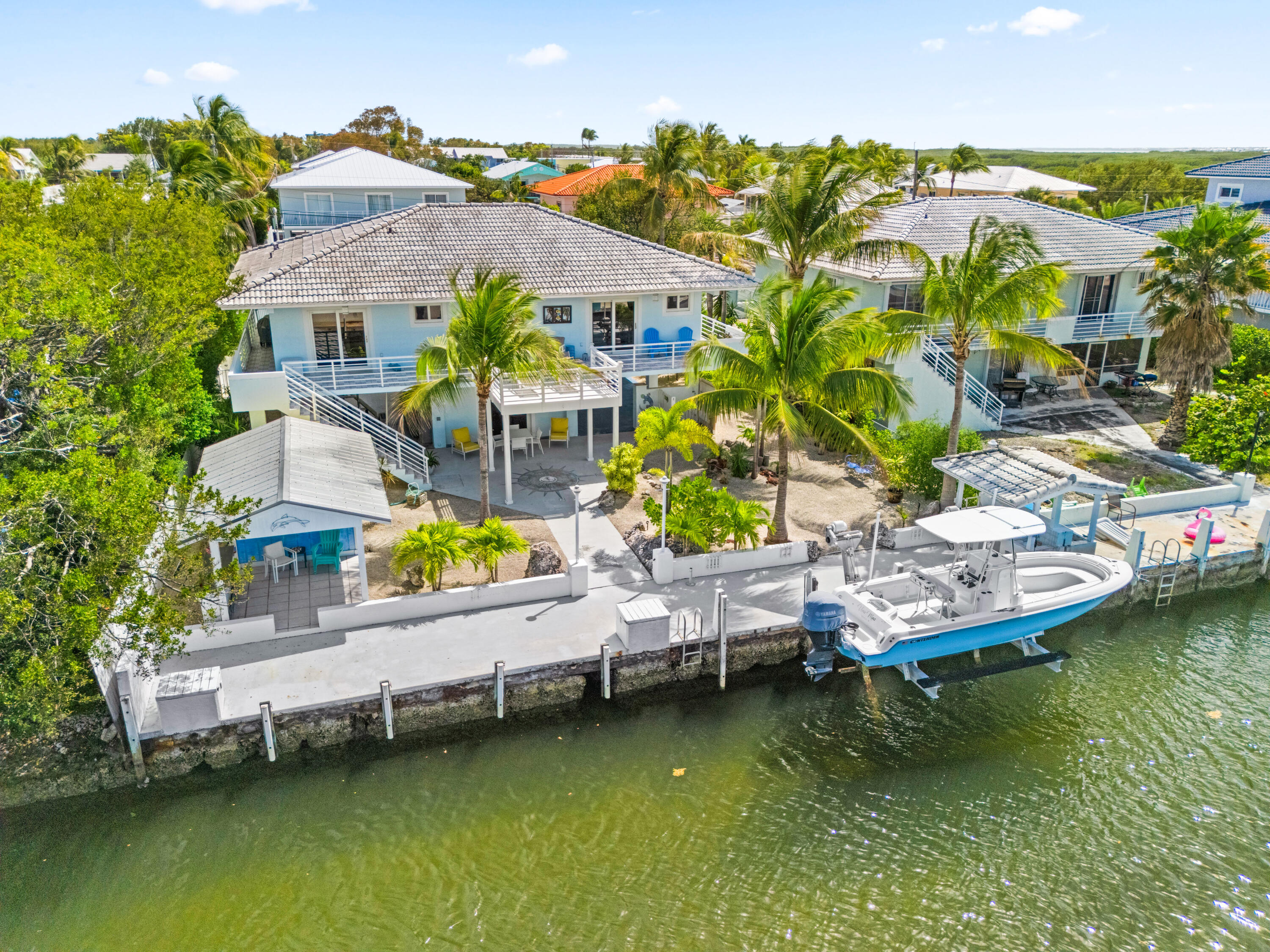 130 Lorelane Place Key Largo, FL 33037 - Photo 60 of 67 a view of swimming pool with outdoor seating and lake view
