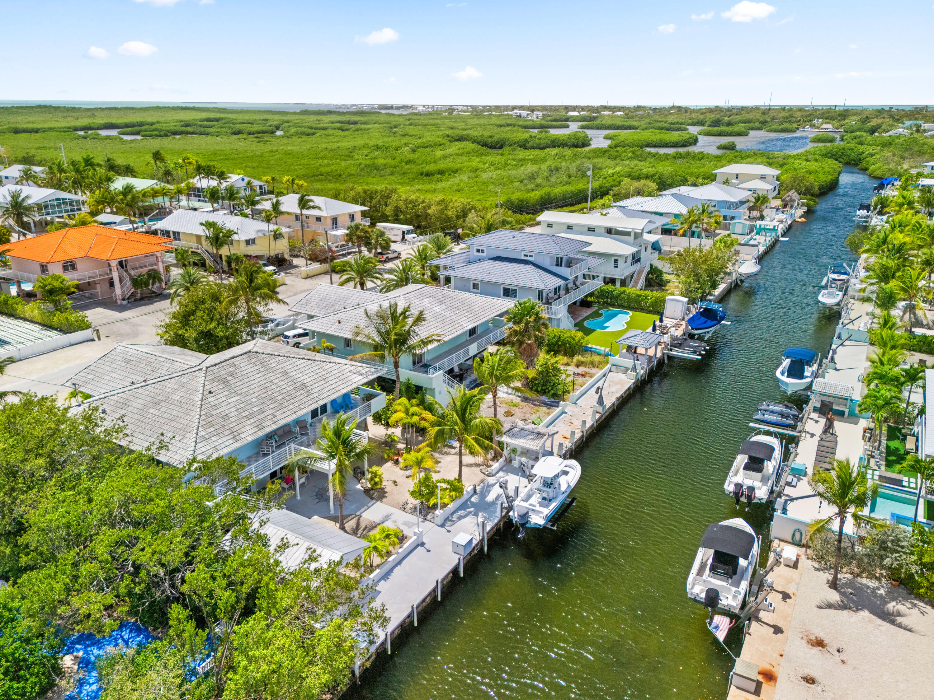 130 Lorelane Place Key Largo, FL 33037 - Photo 61 of 67 an aerial view of water body with boats and large trees all around