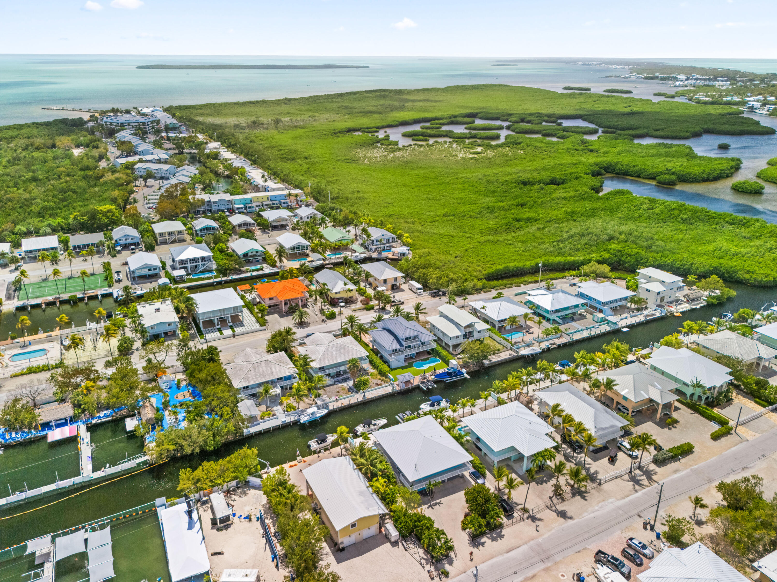 130 Lorelane Place Key Largo, FL 33037 - Photo 62 of 67 an aerial view of ocean and residential houses with outdoor space