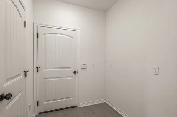 a bedroom with a bed and a table
