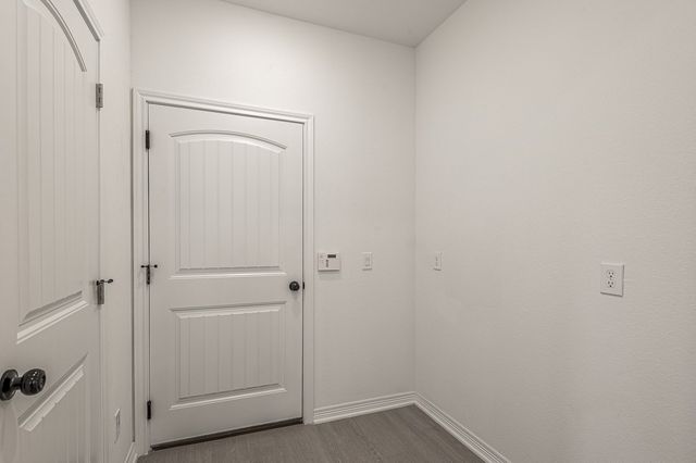 a bedroom with a bed and a table