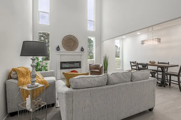 a kitchen with kitchen island a refrigerator stove microwave and cabinets