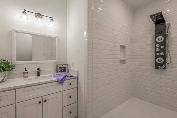 a bathroom with a toilet a sink and a mirror