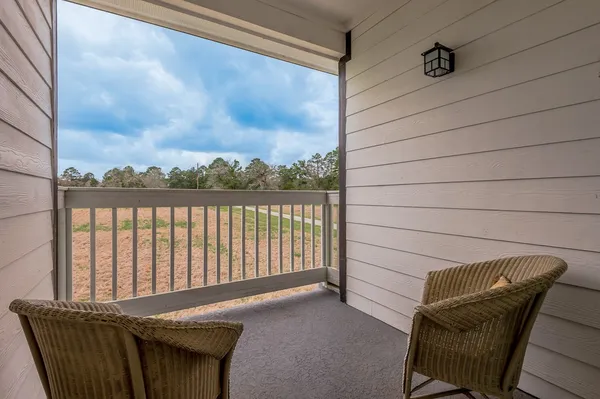 an empty room with a cabinet and mirrors