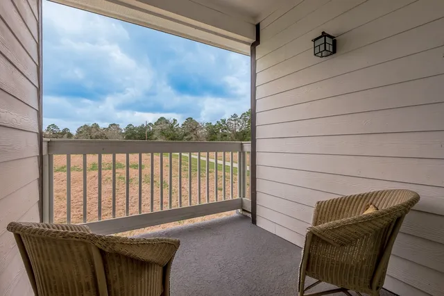 an empty room with a cabinet and mirrors