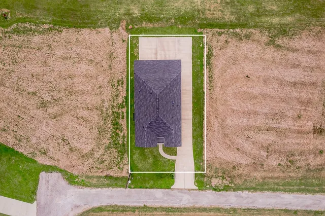 a view of a lake with a yard