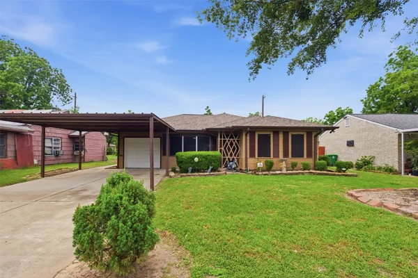 a front view of a house with a yard and porch