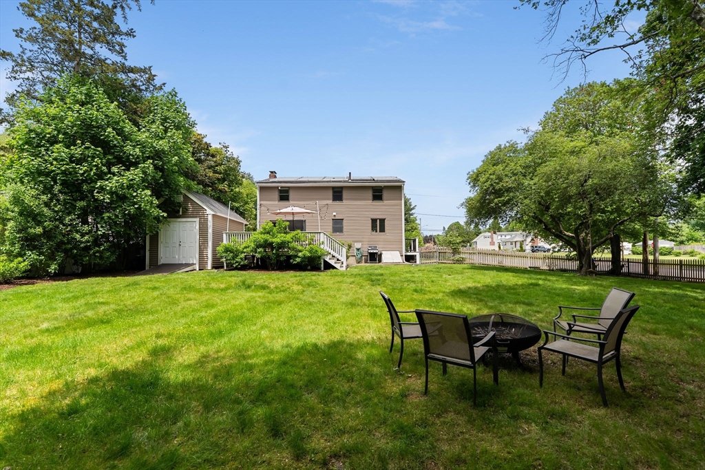 35 Spallus Road Stoughton, MA 02072 - Photo 37 of 39 a view of a house with a backyard