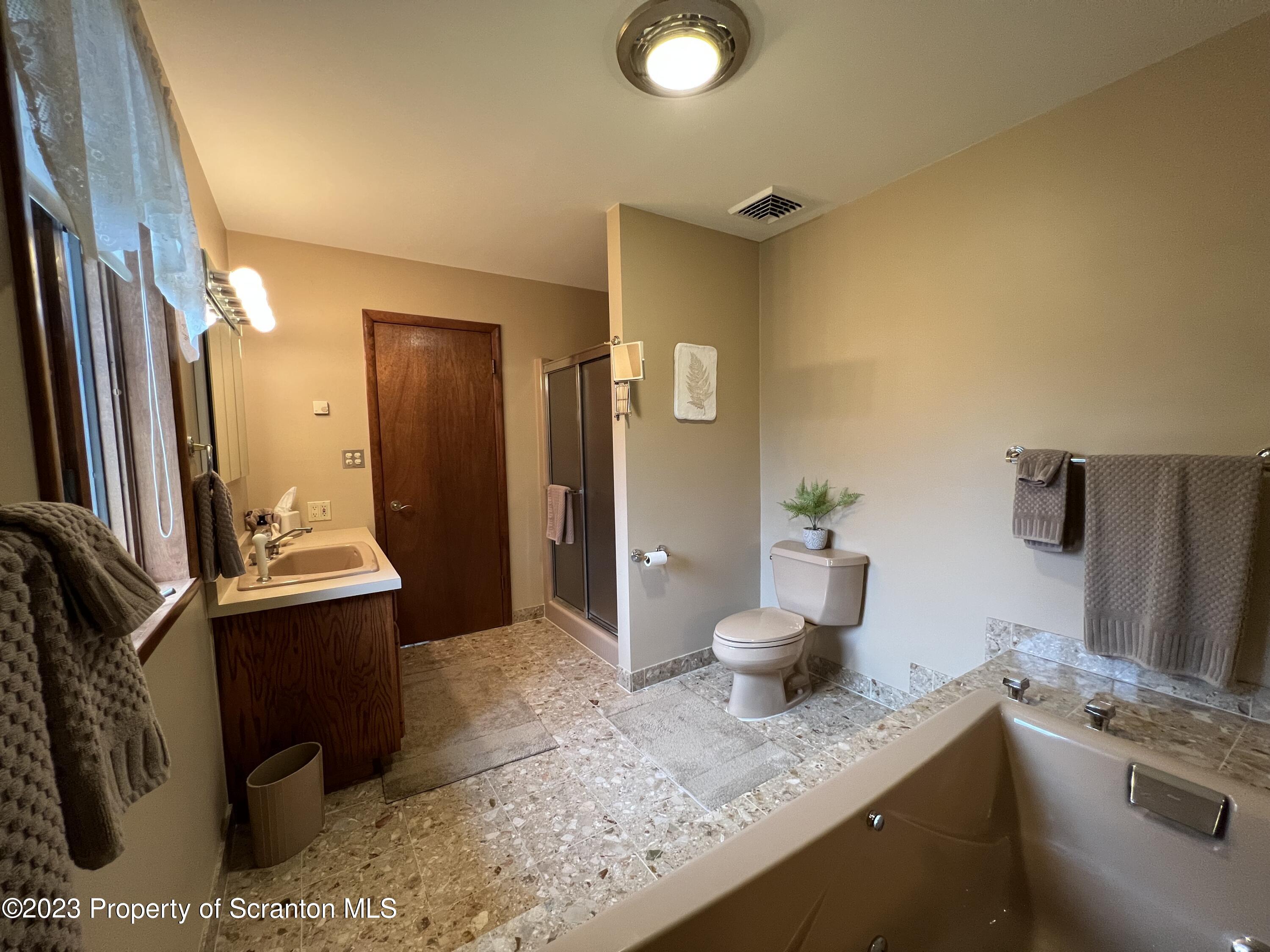 4935 Highway 3001 Meshoppen, PA 18630 - Photo 13 of 31 a bathroom with a granite countertop sink and mirror