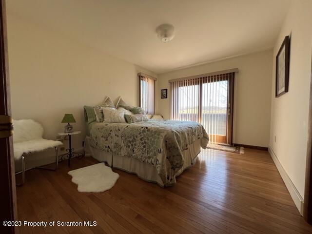 4935 Highway 3001 Meshoppen, PA 18630 - Photo 14 of 31 a spacious bedroom with a bed and wooden floor