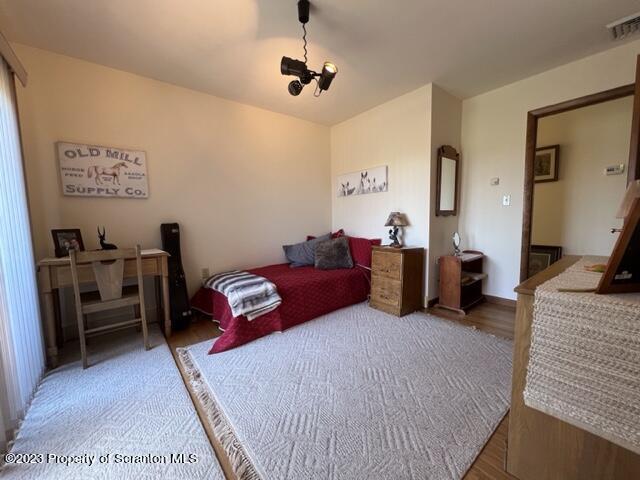 4935 Highway 3001 Meshoppen, PA 18630 - Photo 15 of 31 a bedroom with bed and a chandelier