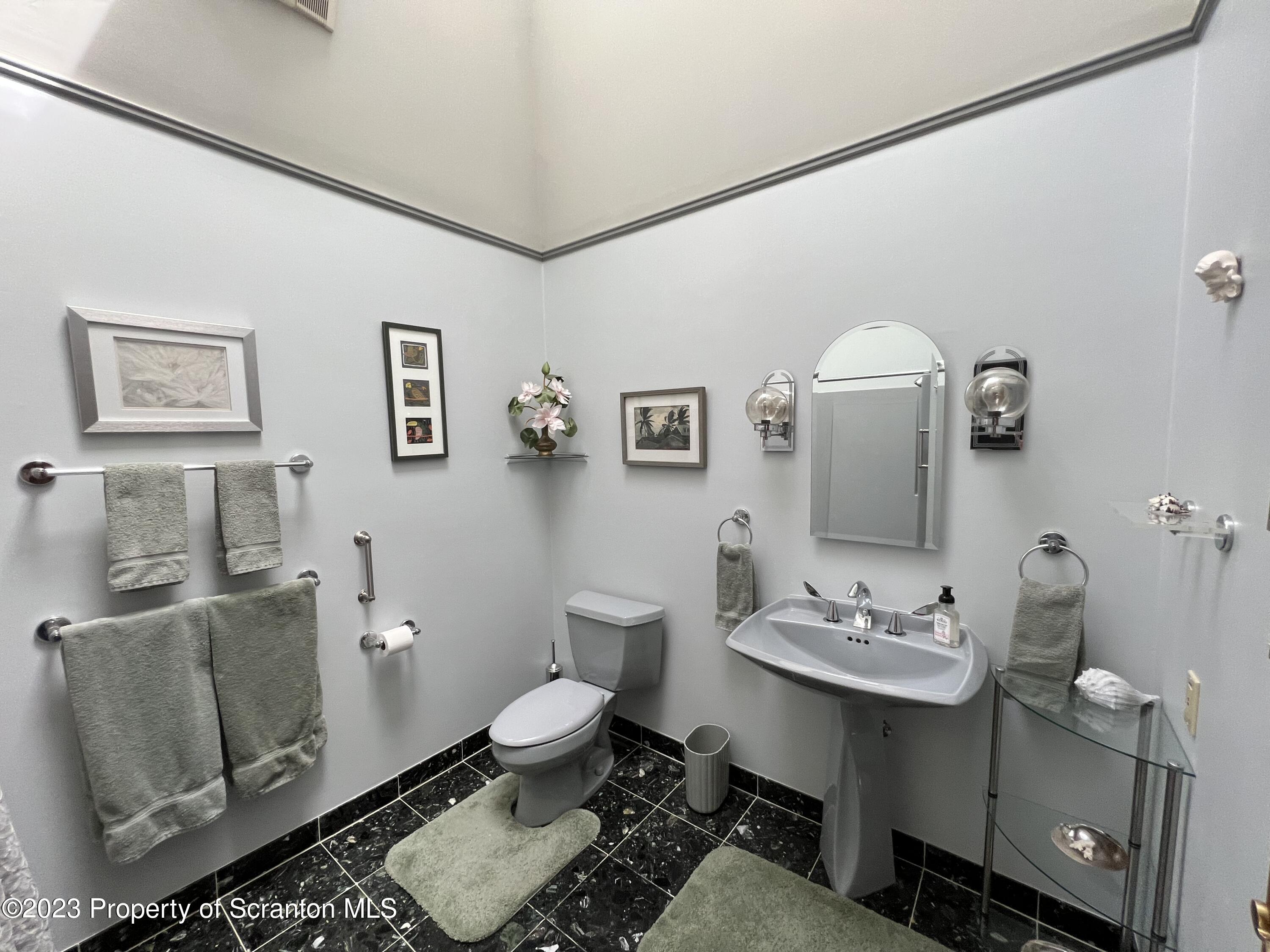 4935 Highway 3001 Meshoppen, PA 18630 - Photo 16 of 31 a bathroom with a toilet sink and mirror