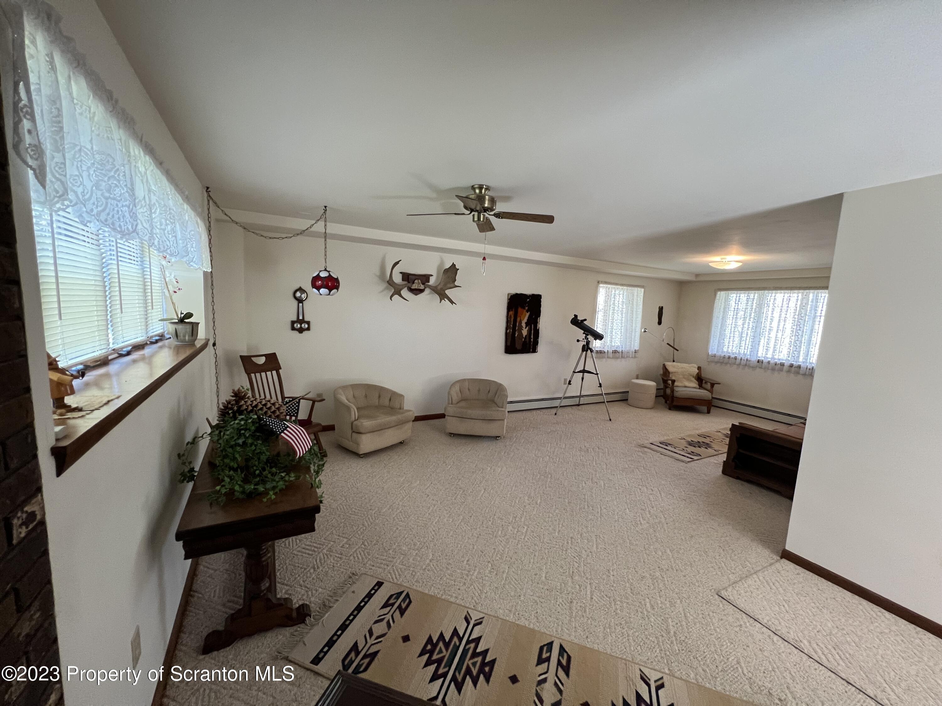 4935 Highway 3001 Meshoppen, PA 18630 - Photo 17 of 31 a living room with furniture and a flat screen tv