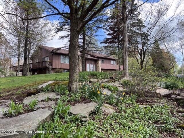 4935 Highway 3001 Meshoppen, PA 18630 - Photo 23 of 31 a front view of a house with garden