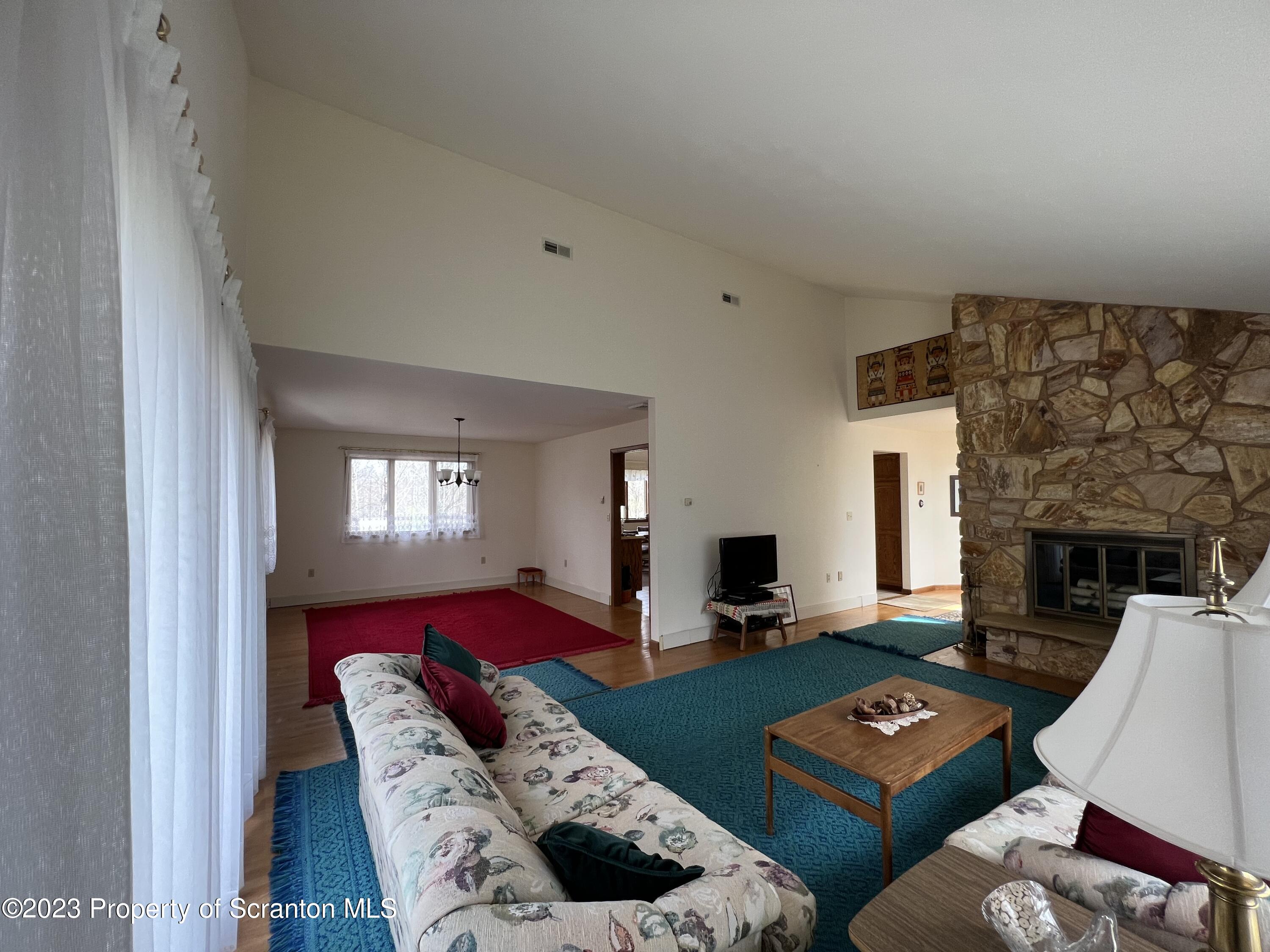 4935 Highway 3001 Meshoppen, PA 18630 - Photo 7 of 31 a living room with furniture and a fireplace