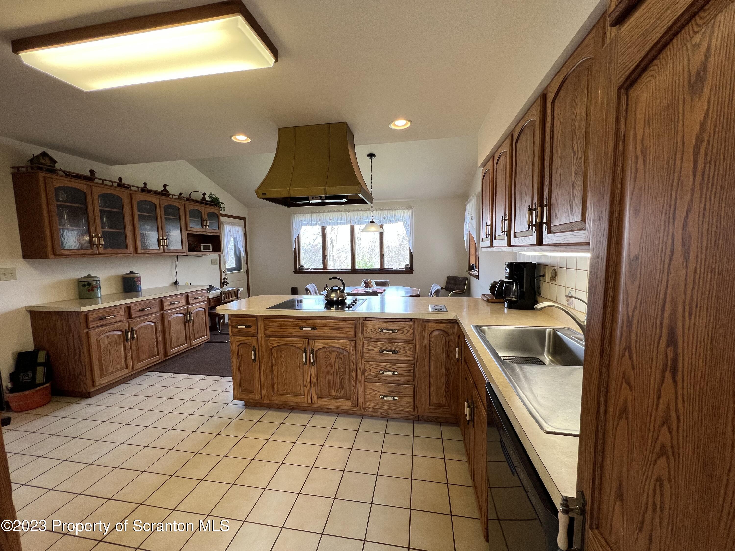 4935 Highway 3001 Meshoppen, PA 18630 - Photo 9 of 31 a kitchen with stainless steel appliances granite countertop a sink and cabinets
