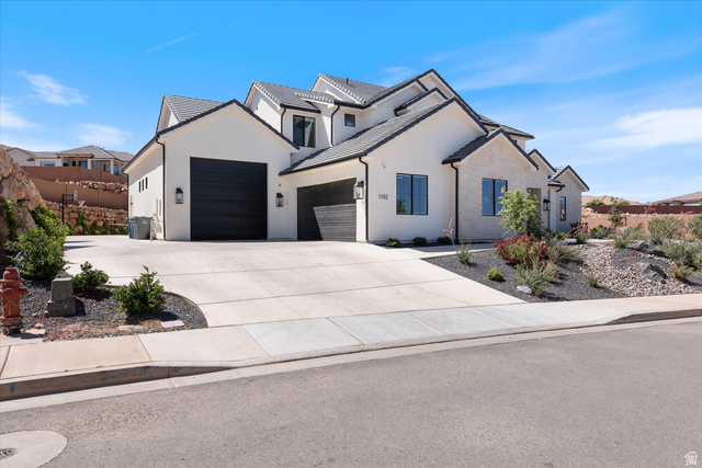 1192 East Corral Way Washington, UT 84780 - Photo 5 of 81 Contemporary-style residence featuring a white stucco exterior with dark trim accents