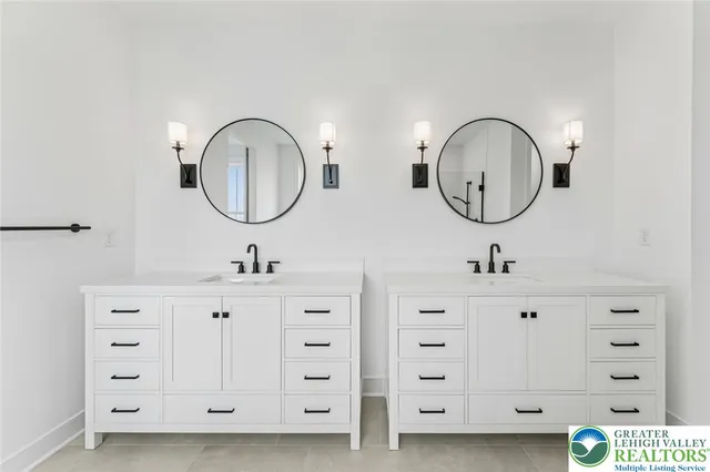 a bathroom with a toilet a sink and shower