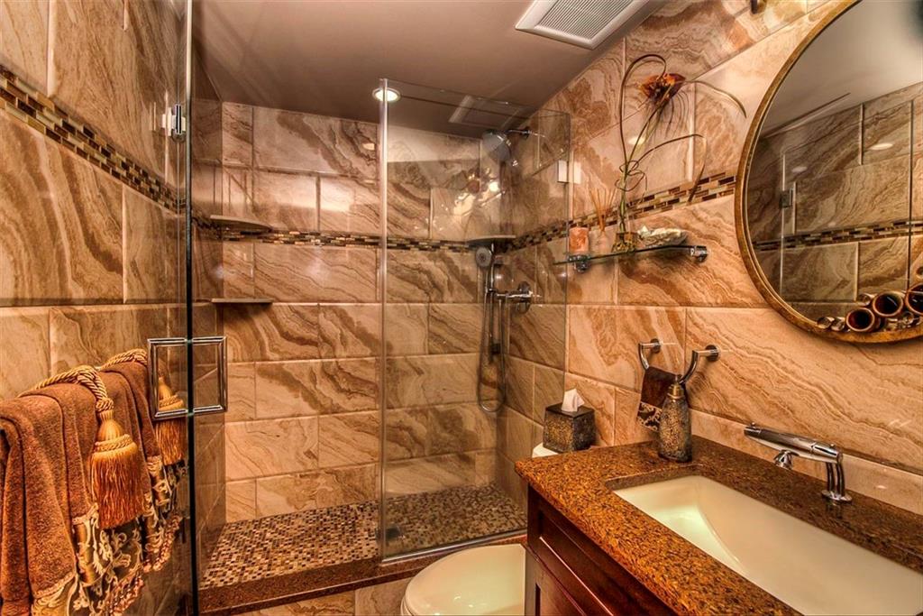 9995 Shore Road, Unit 18C Brooklyn, NY 11209 - Photo 9 of 15 a bathroom with a sink and a mirror