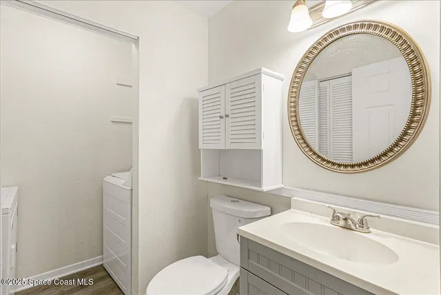 a bathroom with a sink a mirror and a toilet