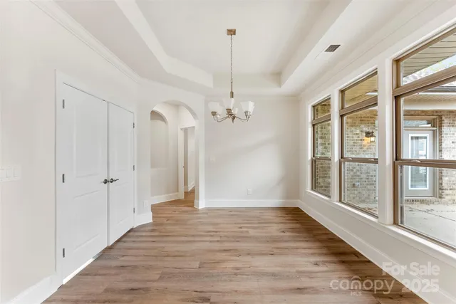 a view of a room with wooden floor and balcony