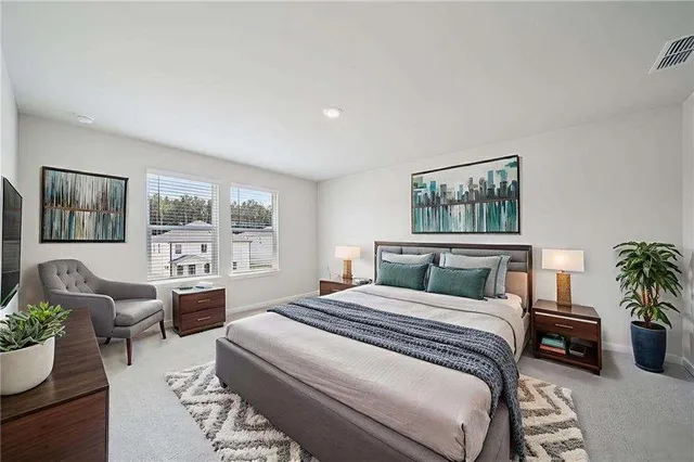 a bedroom with a balcony a bed and a couch