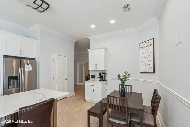 a kitchen with counter top space cabinets and stainless steel appliances