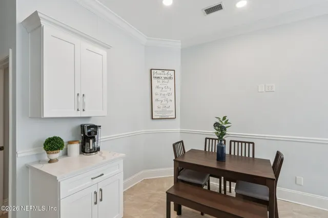 a living room with furniture a rug and a window