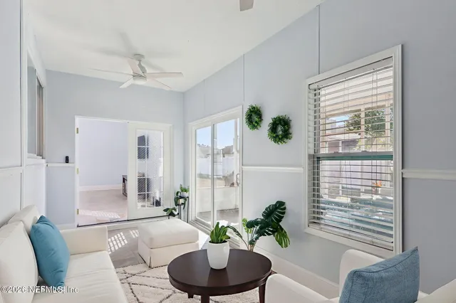 a view of an entryway with wooden floor