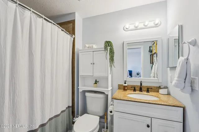 a bed room with a bed and a chandelier