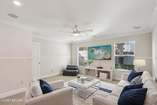 an empty room with a ceiling fan and a window