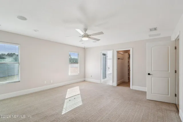 a bathroom with a tub sink shower and mirror