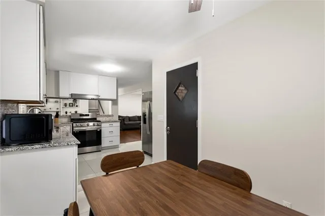 a view of front door with wooden floor