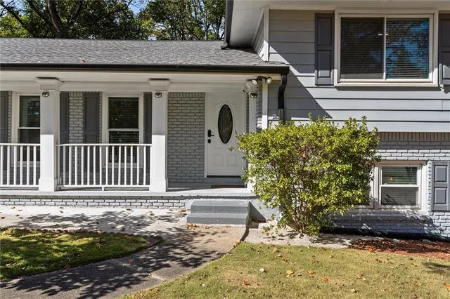 a kitchen with stainless steel appliances a refrigerator stove and microwave