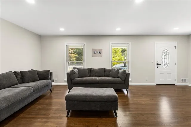 a view of a dining room with furniture window and wooden floor