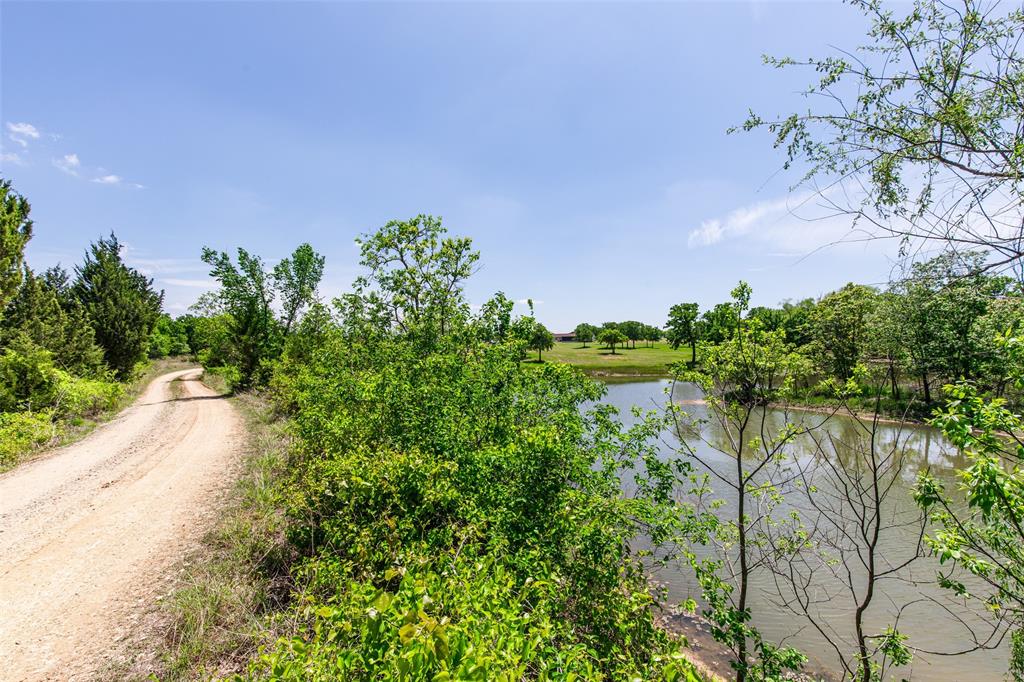 2043 Huddleston Road Sunset, TX 76270 - Photo 24 of 36 a view of a lake with a yard