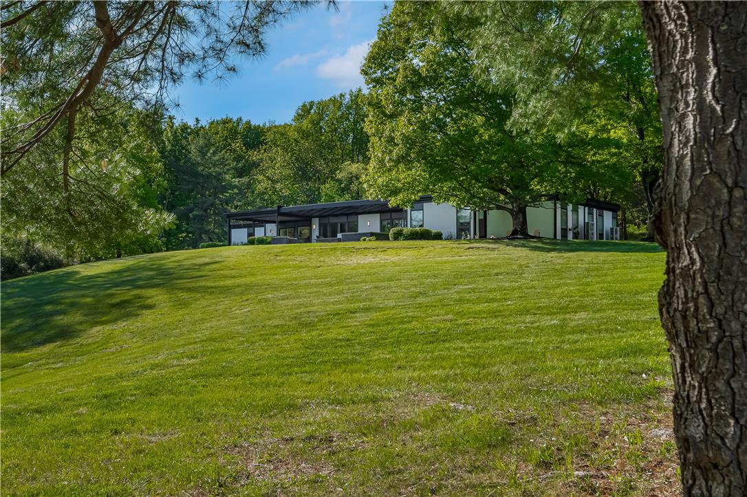 1506 Pleasant View Road Coopersburg, PA 18036 - Photo 90 of 97 A contemporary residence nestled amidst lush, green surroundings.