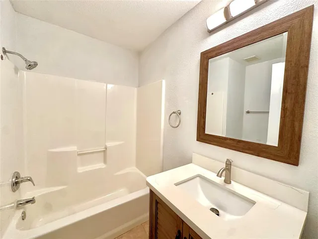 a bathroom with a sink and a bathtub