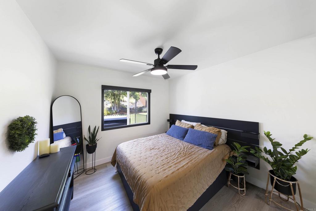 3577 Winslow Road Oceanside, CA 92056 - Photo 16 of 53 a bedroom with a bed and a large window