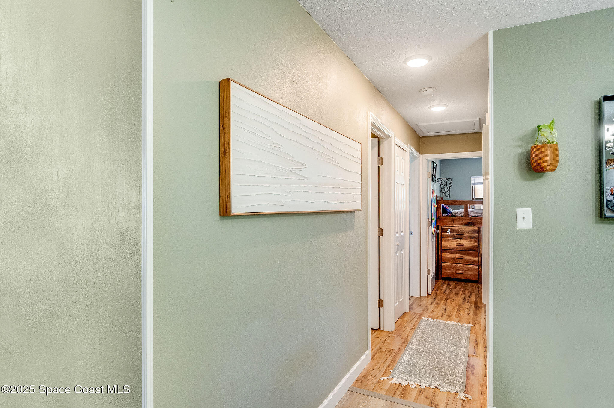 369 Western Avenue Cocoa, FL 32926 - Photo 14 of 38 a view of hallway with wooden floor