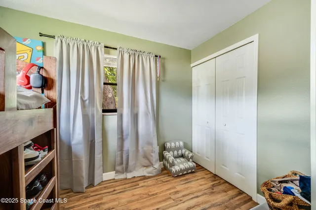 a room with a bed and a window