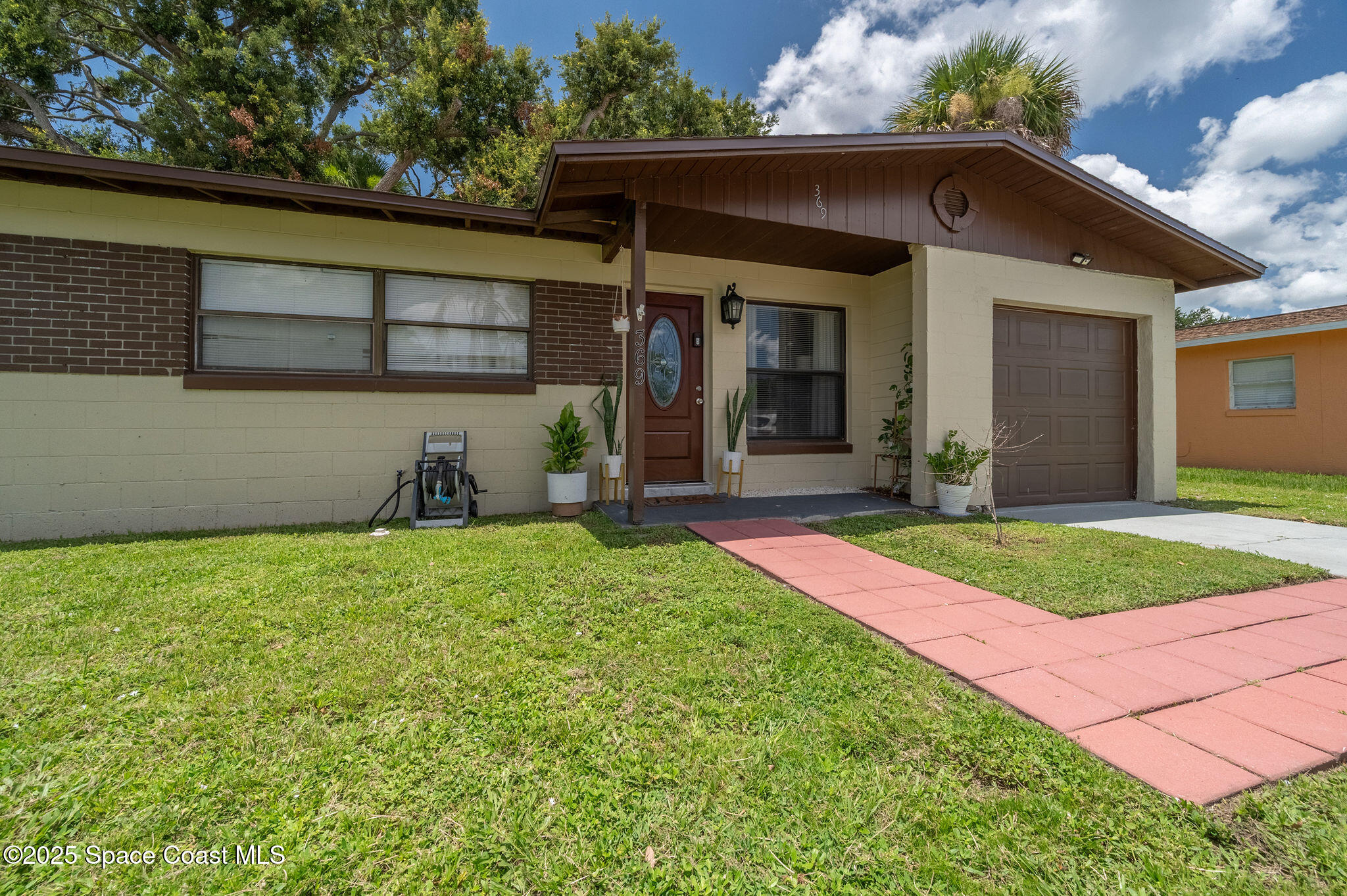 369 Western Avenue Cocoa, FL 32926 - Photo 2 of 38 a front view of a house with garden