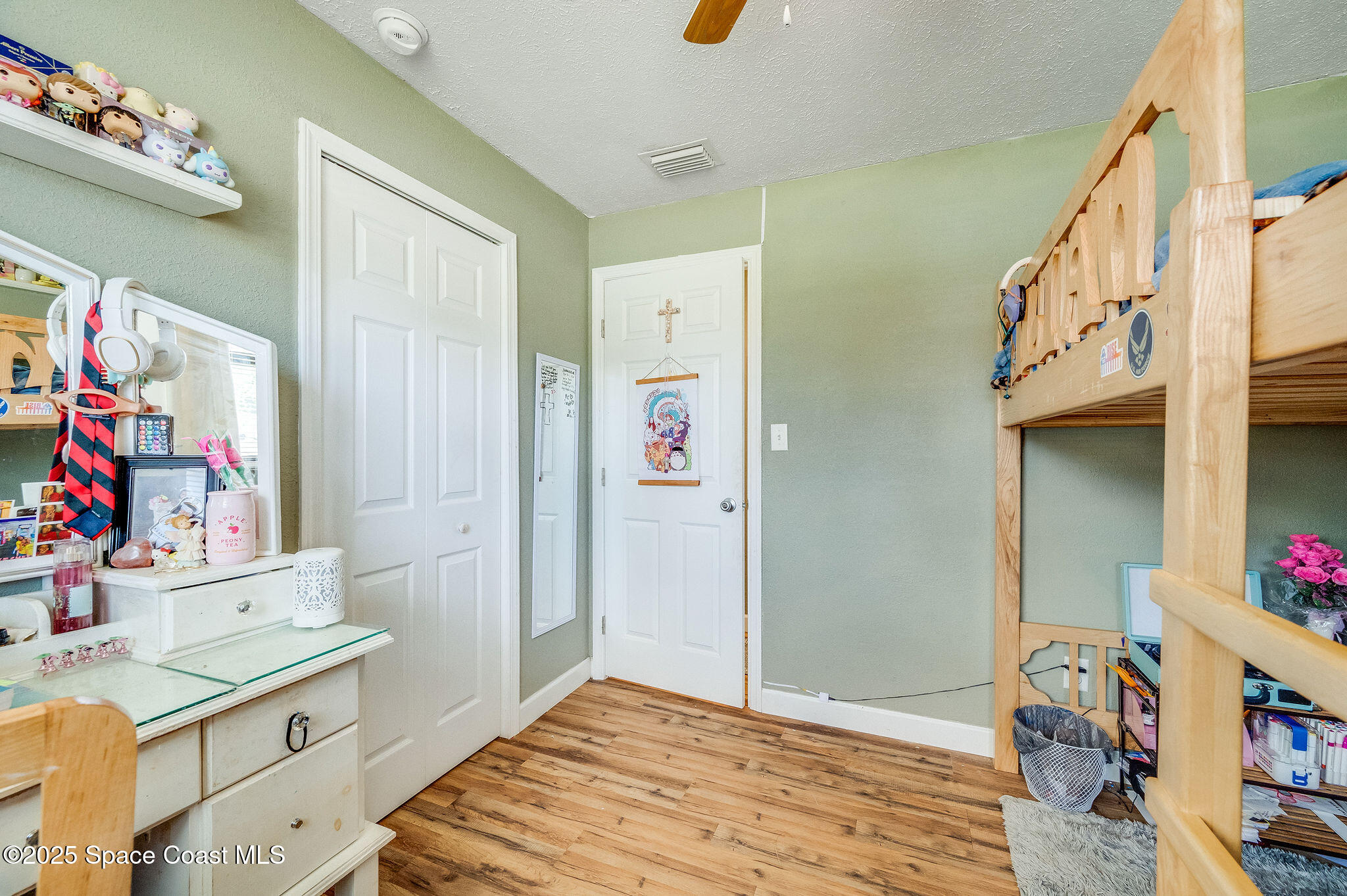 369 Western Avenue Cocoa, FL 32926 - Photo 21 of 38 a bedroom with a bed and a cabinets
