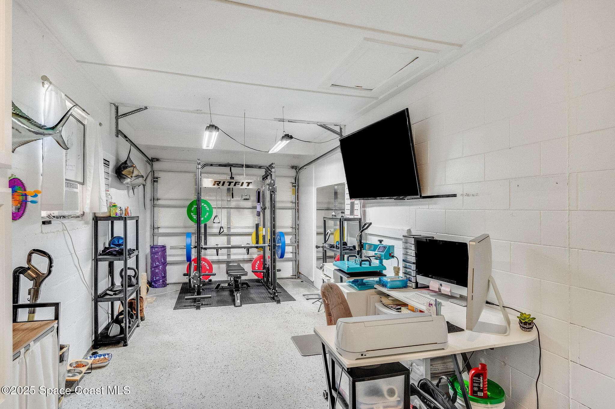 369 Western Avenue Cocoa, FL 32926 - Photo 25 of 38 a living room with furniture a flat screen tv and a fireplace